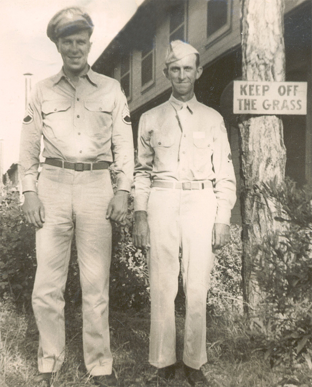Two men beside "Keep off the Grass" sign: on back of picture, says "Andy & Jim, MacDill  Field, Sept. 1943". "Jim" has got to be Jim Whalen, also large group picture